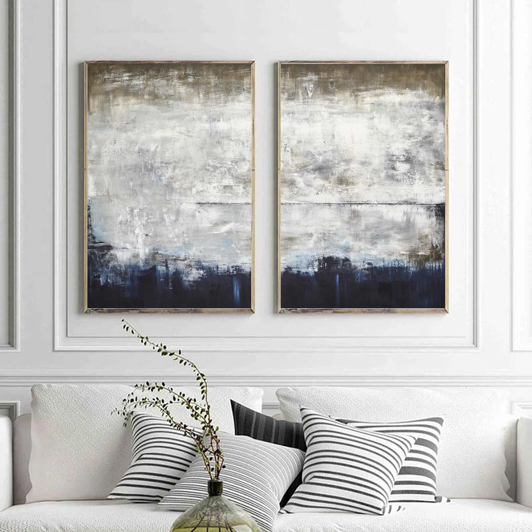 diptych paintings above sofa couch