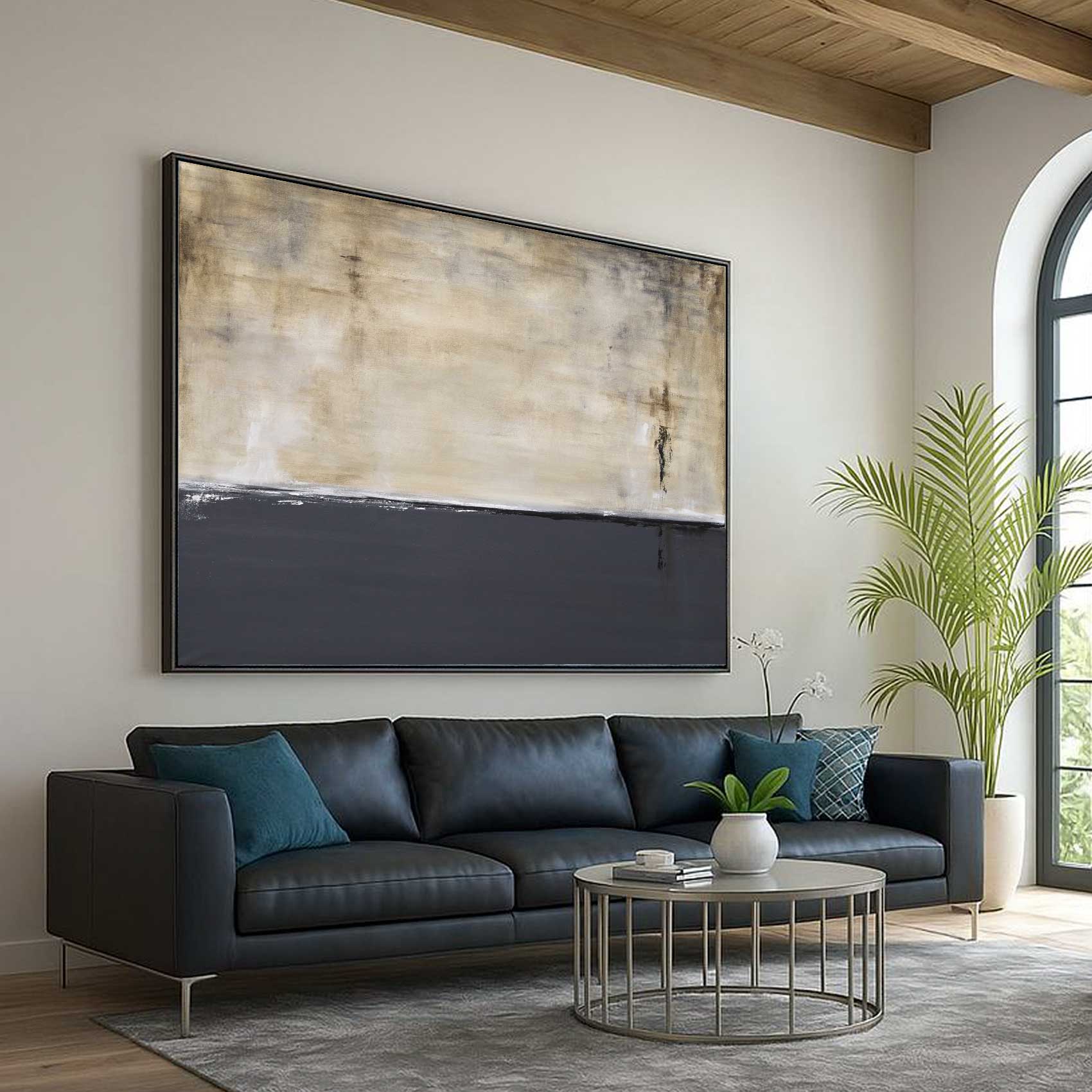 Modern living room with a gray sofa, round coffee table, and abstract painting on the wall.