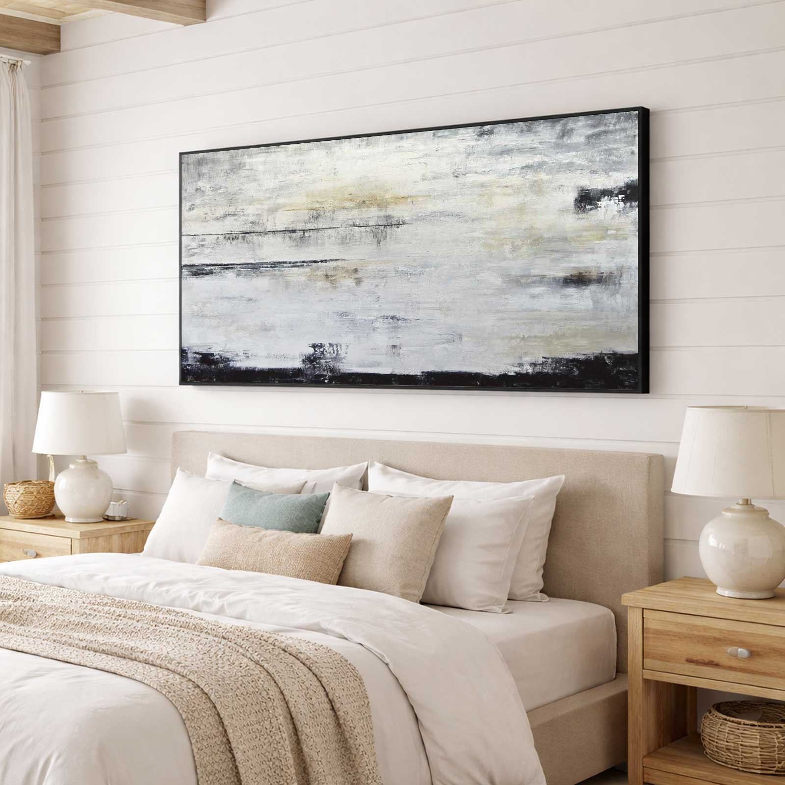 painting in black frame above bed