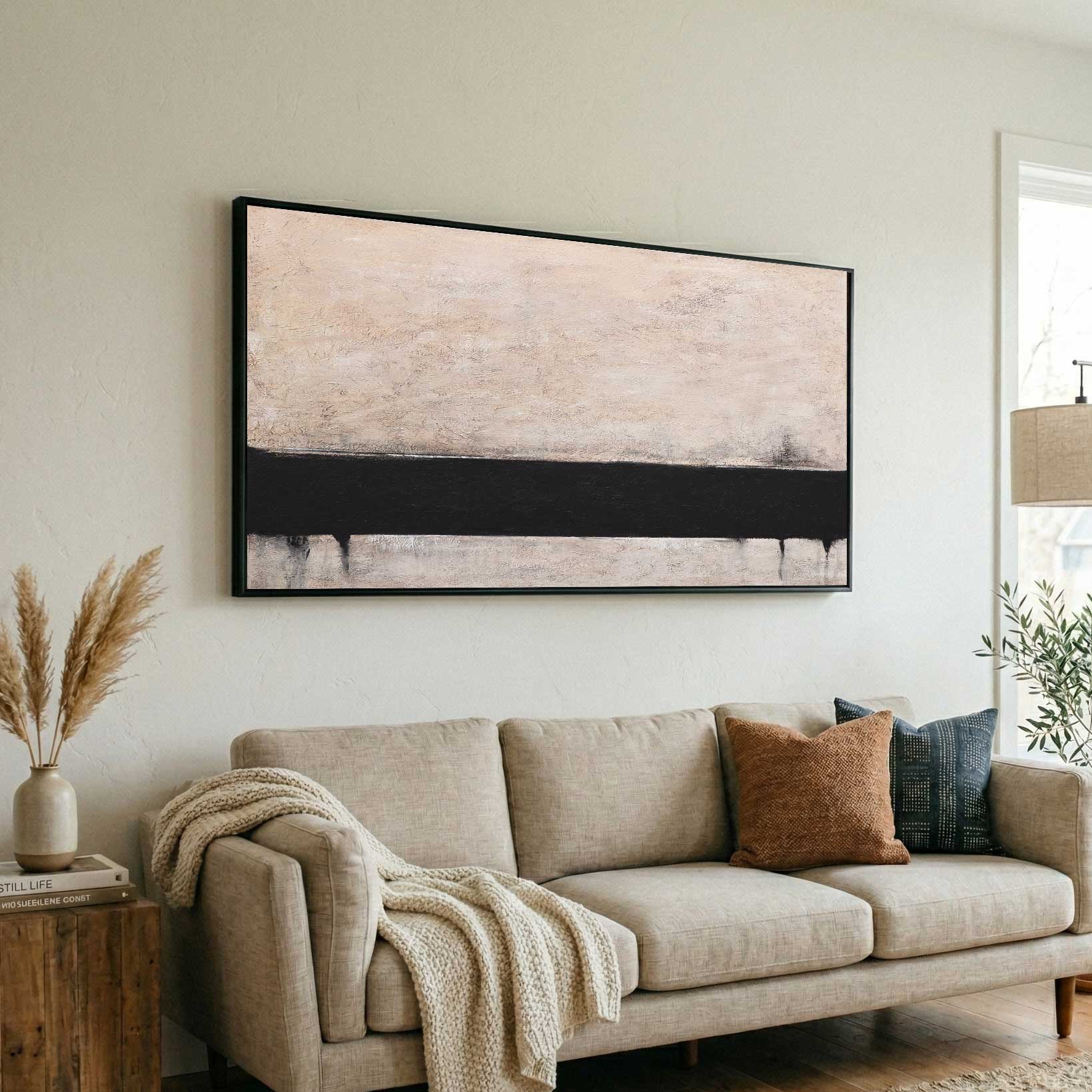 warm colors artwork above couch living room