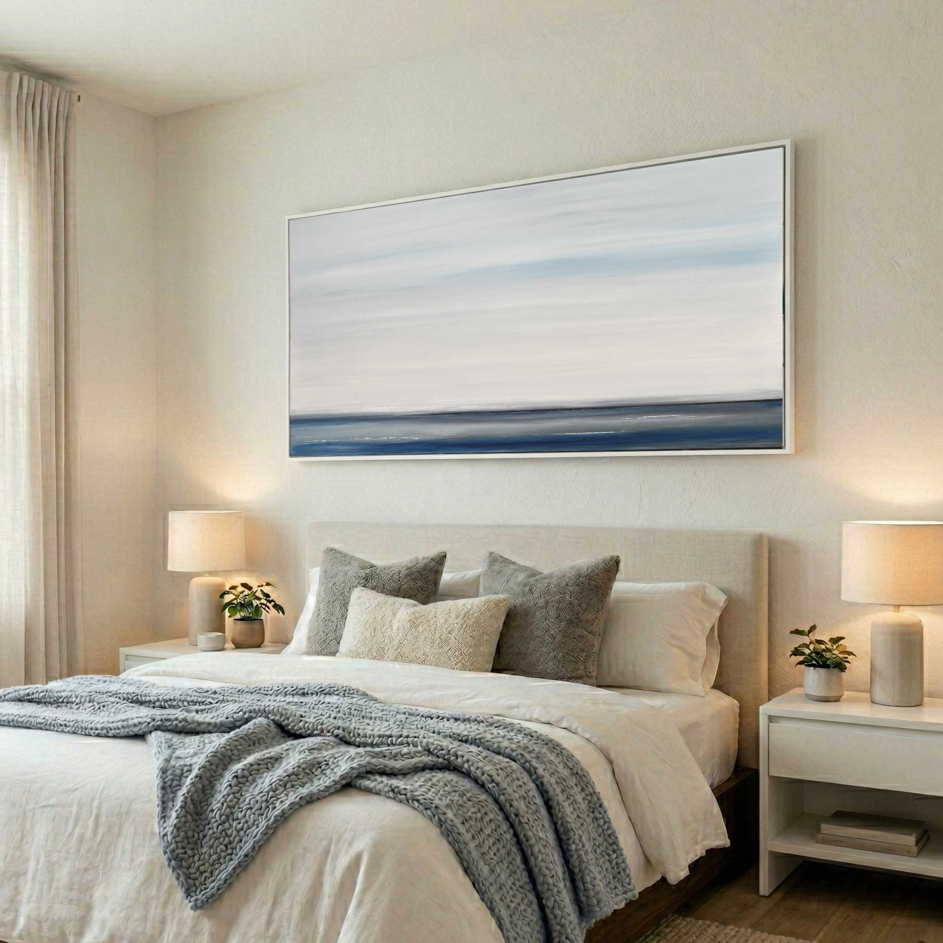 minimalist clean painting in white frame hanging in bedroom