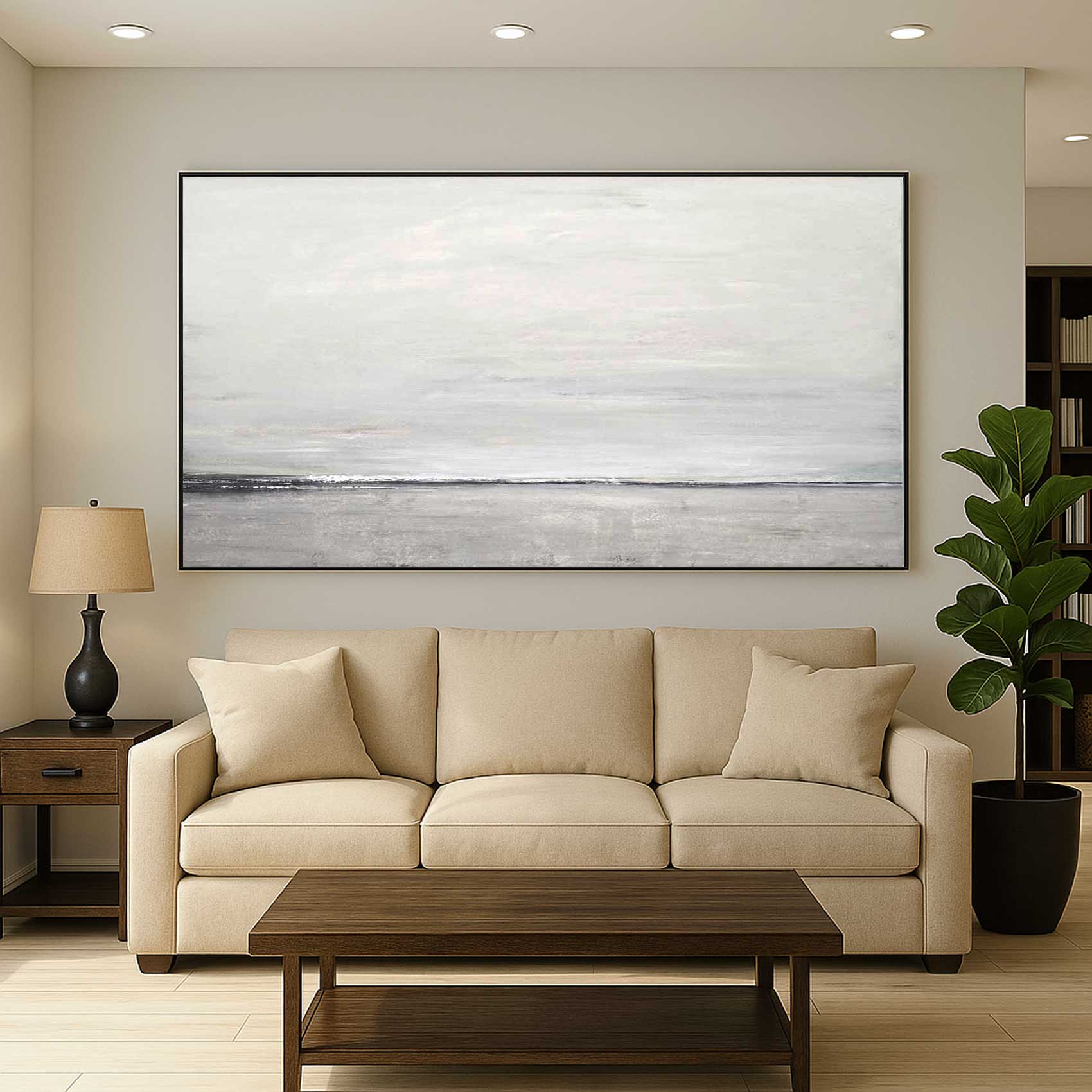 Beige sofa in a living room with a large abstract painting on the wall.