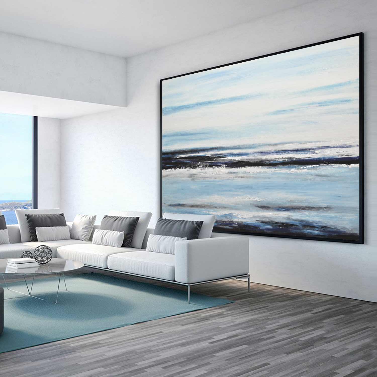 blue white seascape art above couch